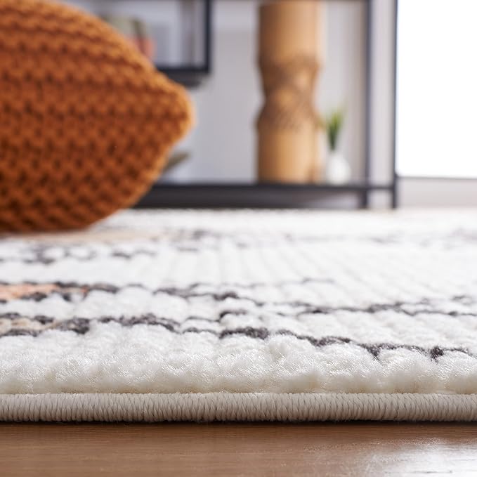 SAFAVIEH Moroccan Tassels Collection Area Rug - 5'5" x 7'6", Ivory & Orange, Modern Boho Rustic Design, Non-Shedding & Easy Care, Ideal for High Traffic Areas in Living Room, Bedroom (MRT105A)