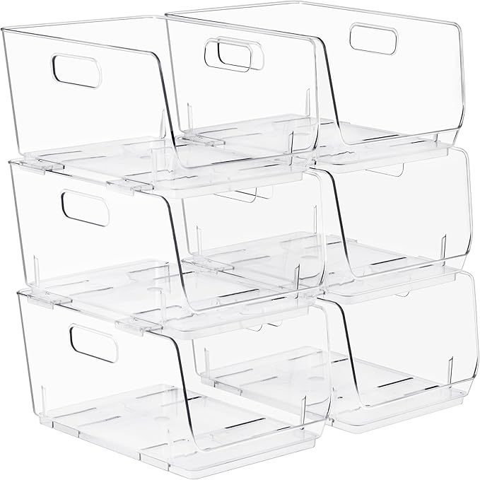 Stack of clear plastic storage bins with handles on a white background