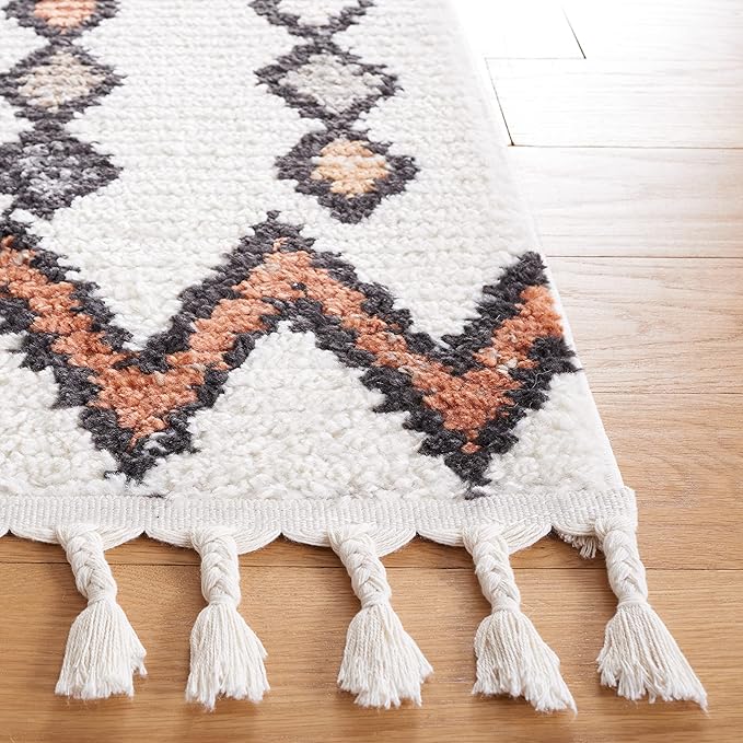 SAFAVIEH Moroccan Tassels Collection Area Rug - 5'5" x 7'6", Ivory & Orange, Modern Boho Rustic Design, Non-Shedding & Easy Care, Ideal for High Traffic Areas in Living Room, Bedroom (MRT105A)