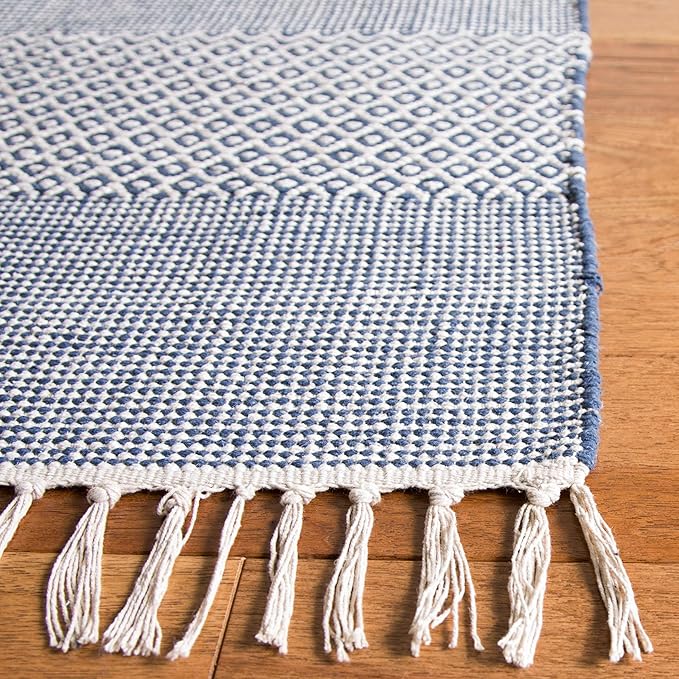 SAFAVIEH Montauk Collection Area Rug - 5' x 8', Ivory & Navy, Handmade Flat Weave Boho Farmhouse Cotton Tassel Fringe, Ideal for High Traffic Areas in Living Room, Bedroom (MTK330B)