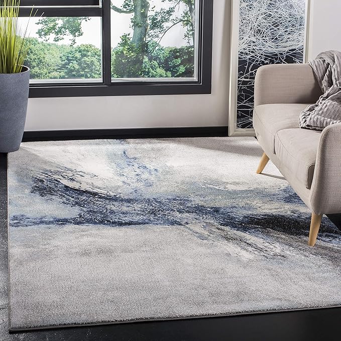 SAFAVIEH Galaxy Collection Area Rug - 6'7" x 9', Blue & Grey, Modern Abstract Design, Non-Shedding & Easy Care, Ideal for High Traffic Areas in Living Room, Bedroom (GAL117M)