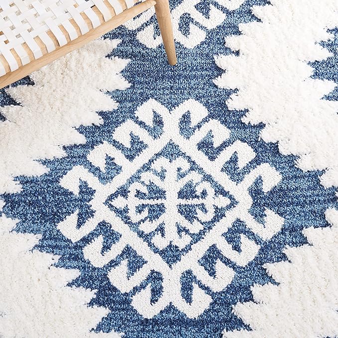 SAFAVIEH Moroccan Tassel Shag Collection Area Rug - 6'7" x 9'2", Blue & Ivory, Boho Design, Non-Shedding & Easy Care, 2-inch Thick Ideal for High Traffic Areas in Living Room, Bedroom (MTS652M)